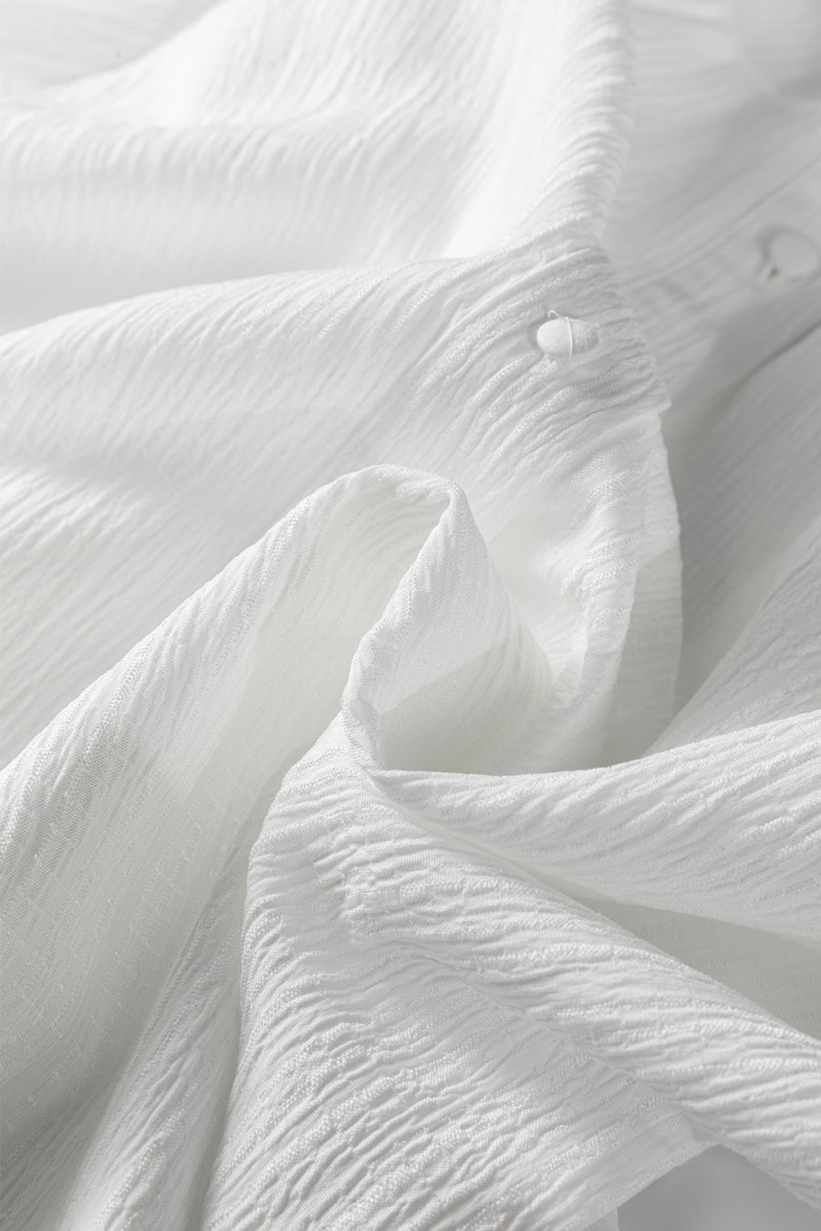 White crinkled texture shirt with button detail
