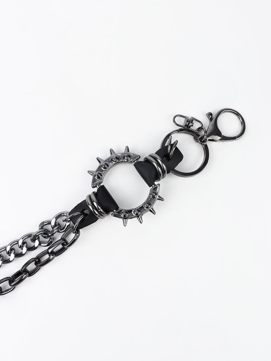 Black spiked chain harness belt with aluminum hardware and clasp.