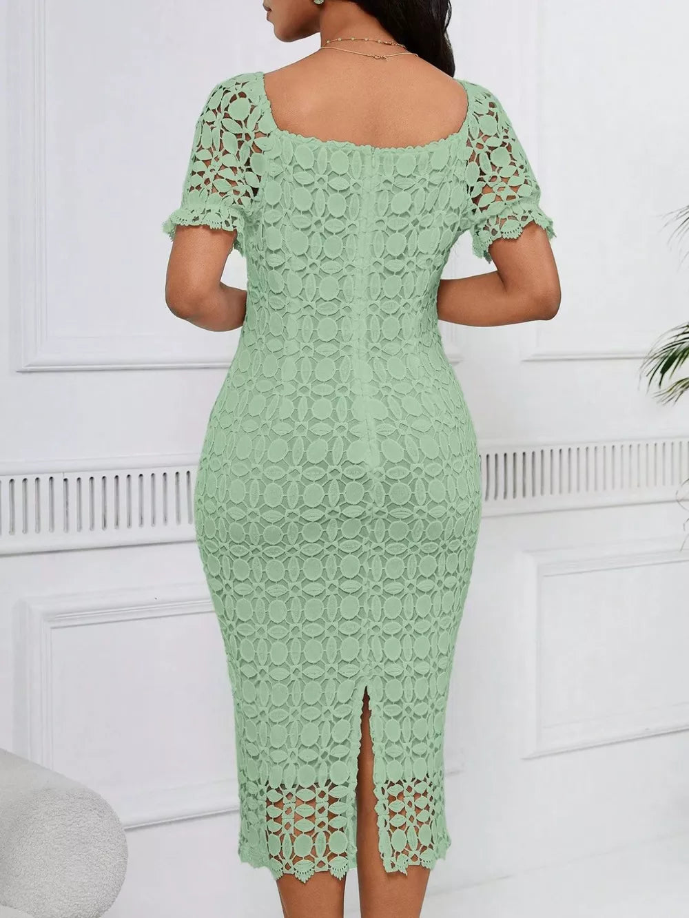 Light green lace midi dress with short sleeves, square neckline, and a slit.