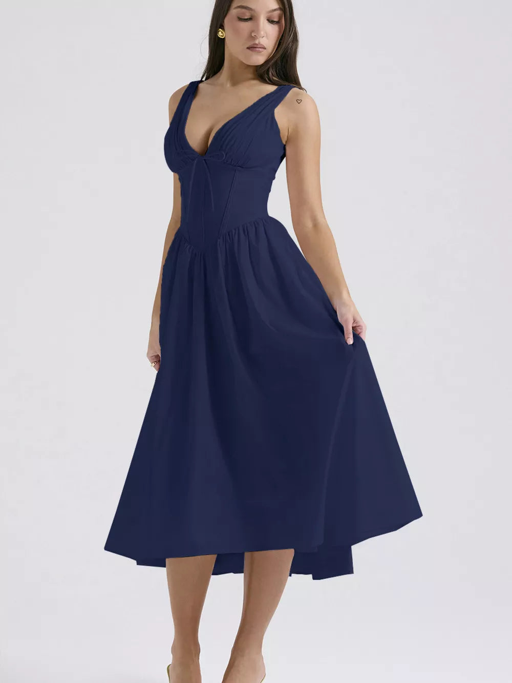 Navy v-neck midi dress with ruched bodice and tie detail, a-line skirt.