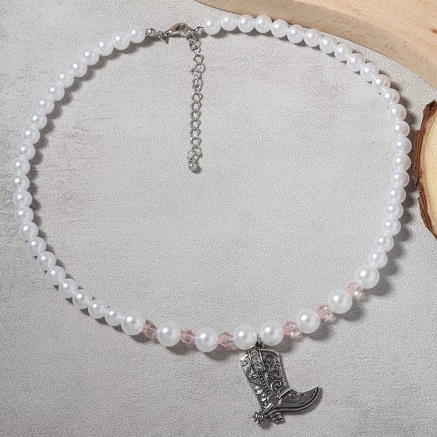 Synthetic Pearl, Zinc alloy, Silver-plated Care instructions: Avoid wearing duri necklace in silver with straight silhouette