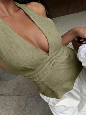 Textured halter tank top in olive green with decorative bands and a deep V-neck.
