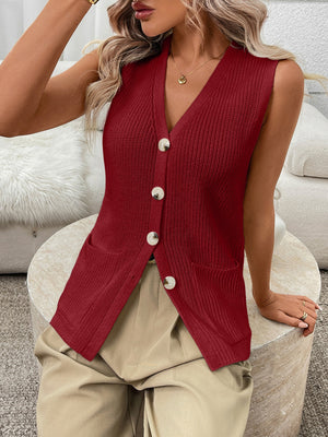 Button-down knit sweater vest in burgundy with V-neck, pockets, and silver buttons.