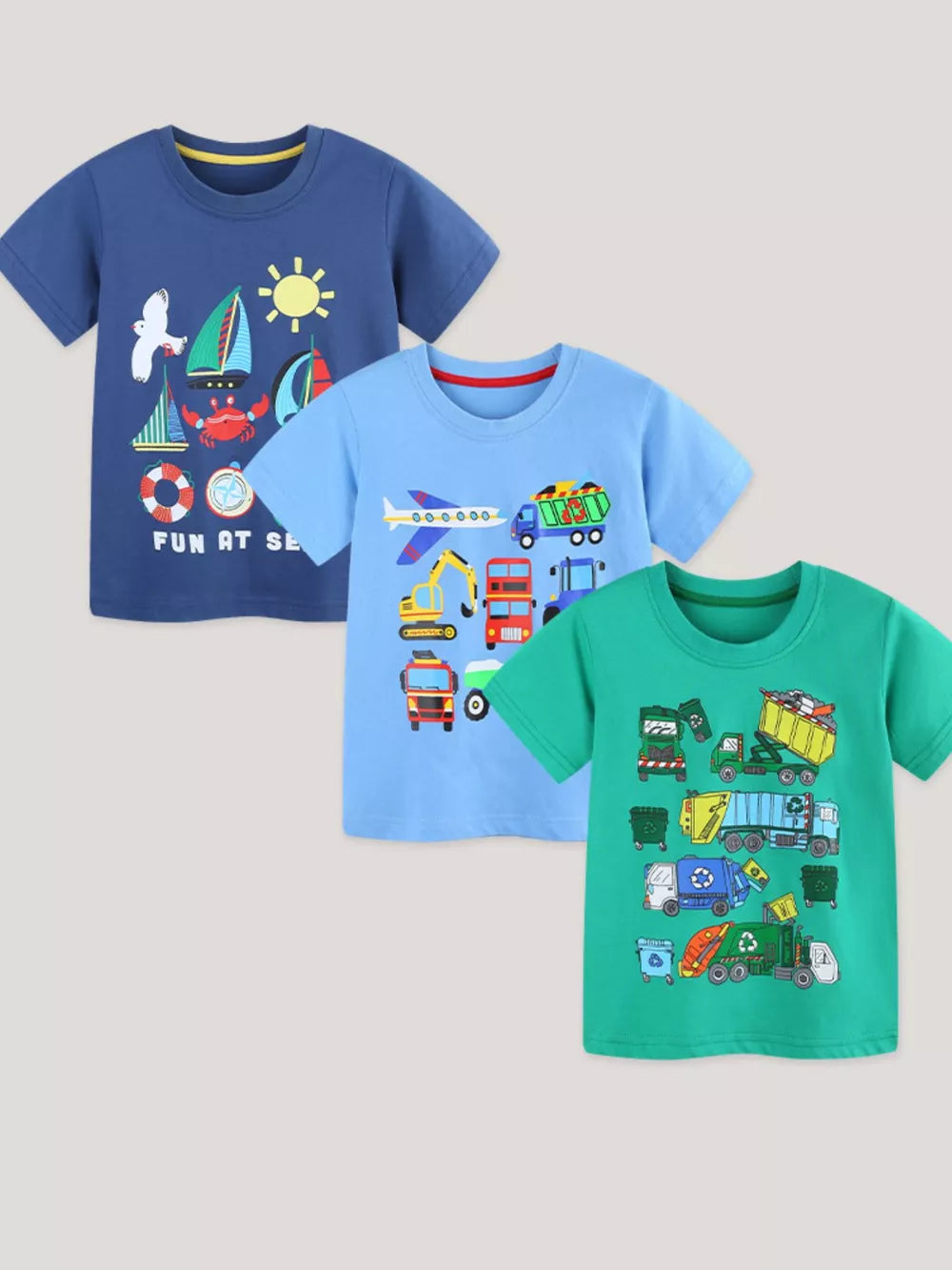Toddler cotton t-shirts in blue, light blue, and green featuring vehicle graphics like construction trucks and garbage