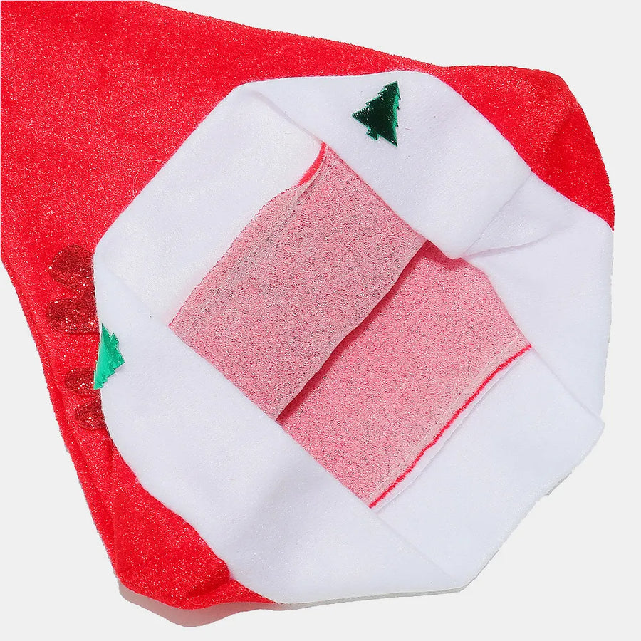 Red festive party hat with white trim, green Christmas trees and glittery antlers.