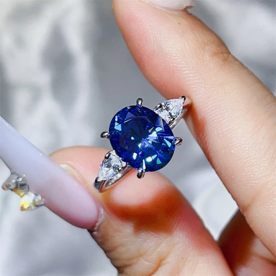 Platinum-plated, 925 sterling silver, Moissanite, Zircon (accent stones) Carat w ring in Royal Blue with straight silhouette