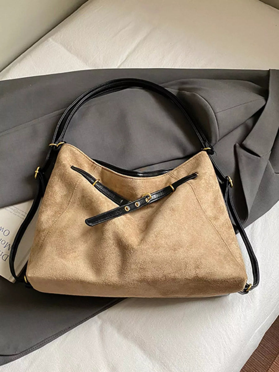 Khaki suede tote bag with black trim and buckle detail