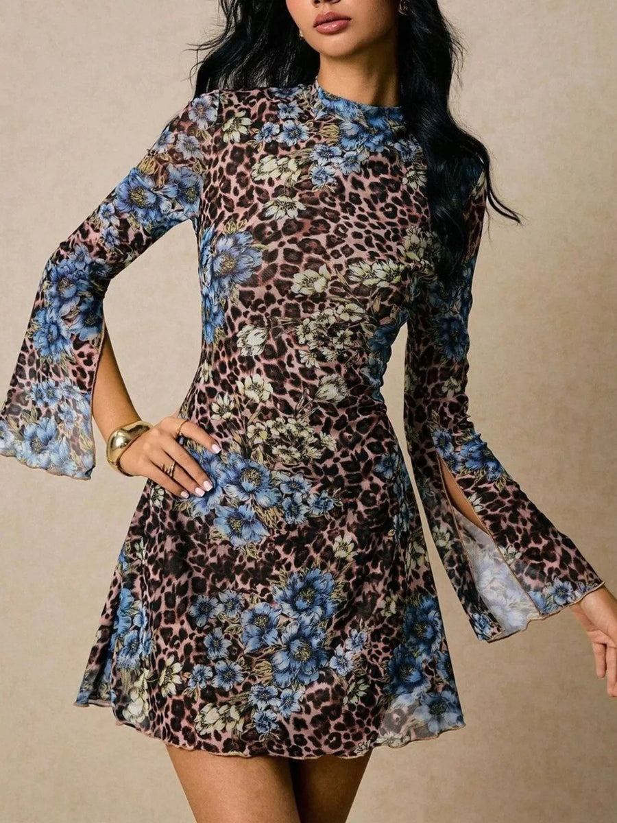 Leopard print floral mini dress with mock neck and slit flare sleeves.