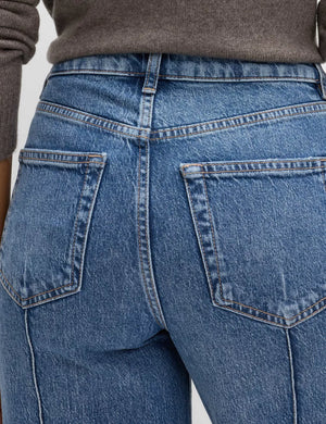 Seam-detail wide leg maternity jeans in blue denim with back pockets.