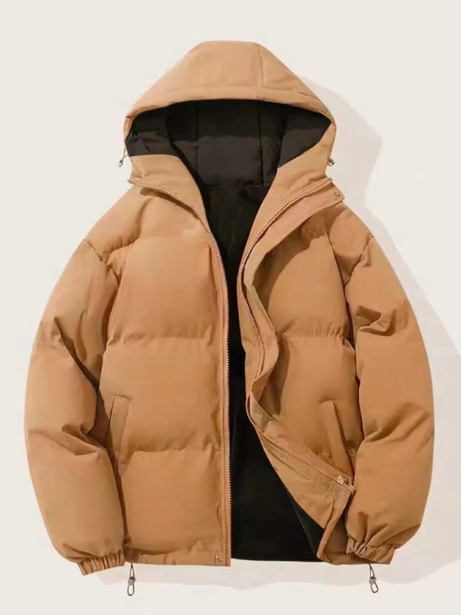 Brown oversized puffer jacket with hood and zip closure, featuring deep pockets.