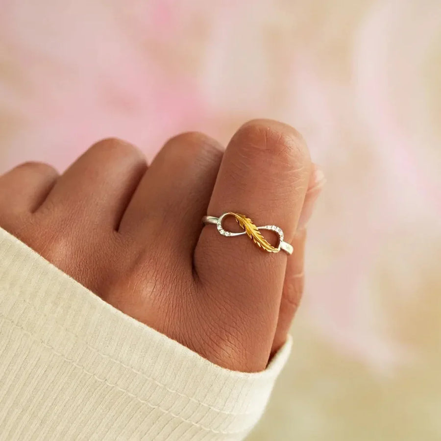 Gold infinity feather sterling ring with small crystals