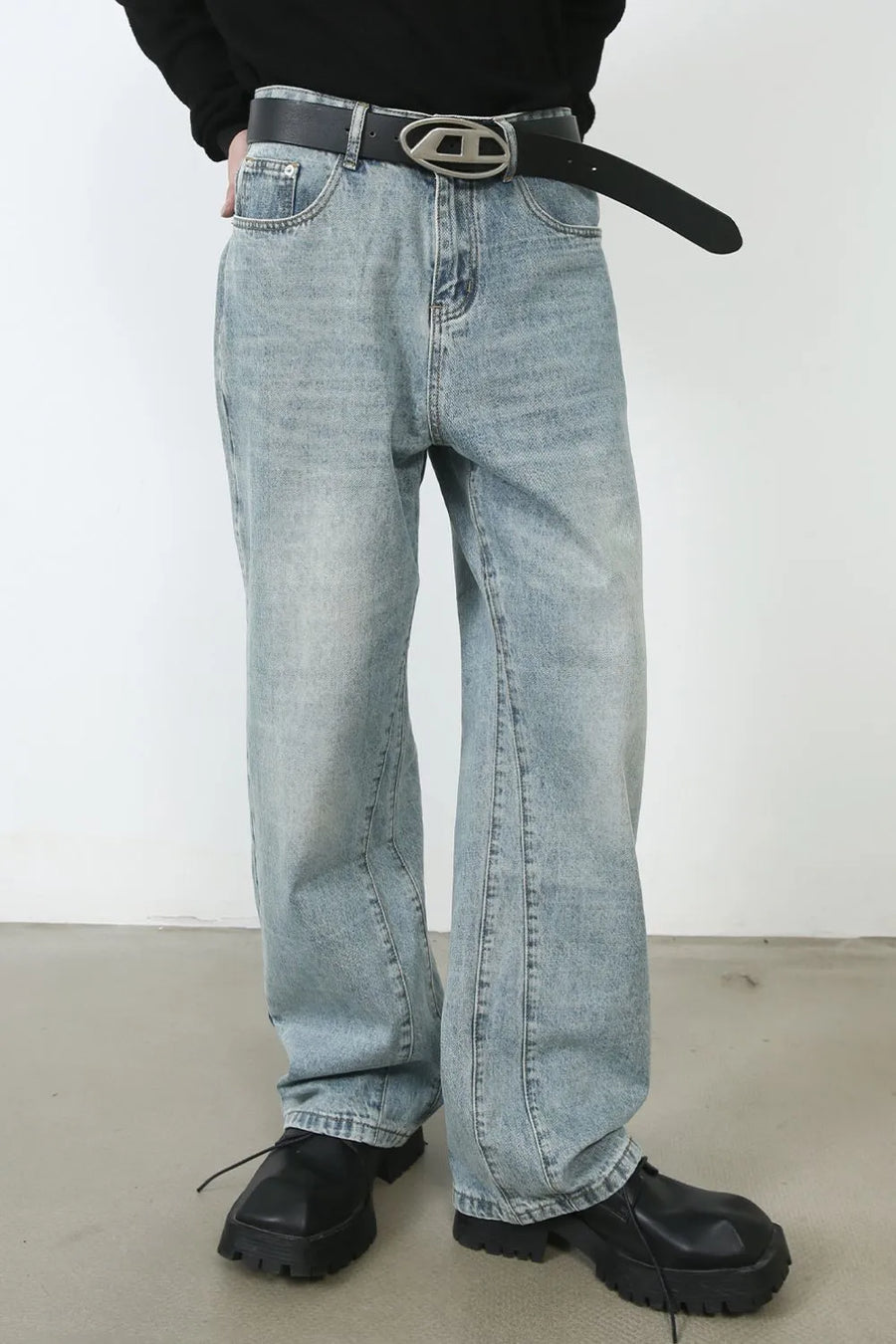Wide-leg denim jeans in medium wash with subtle seam detail down the leg.