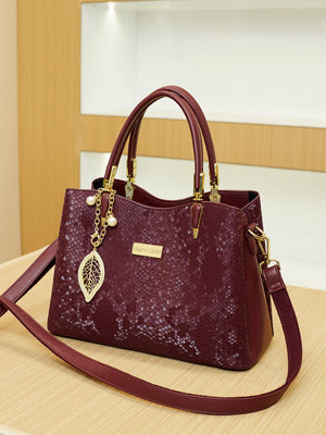 handbag featuring snakeskin in burgundy with PU Leather Imported Size &amp texture