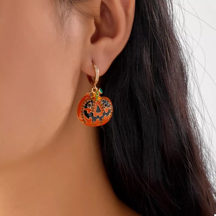 black earrings featuring drop earrings and pumpkin motif