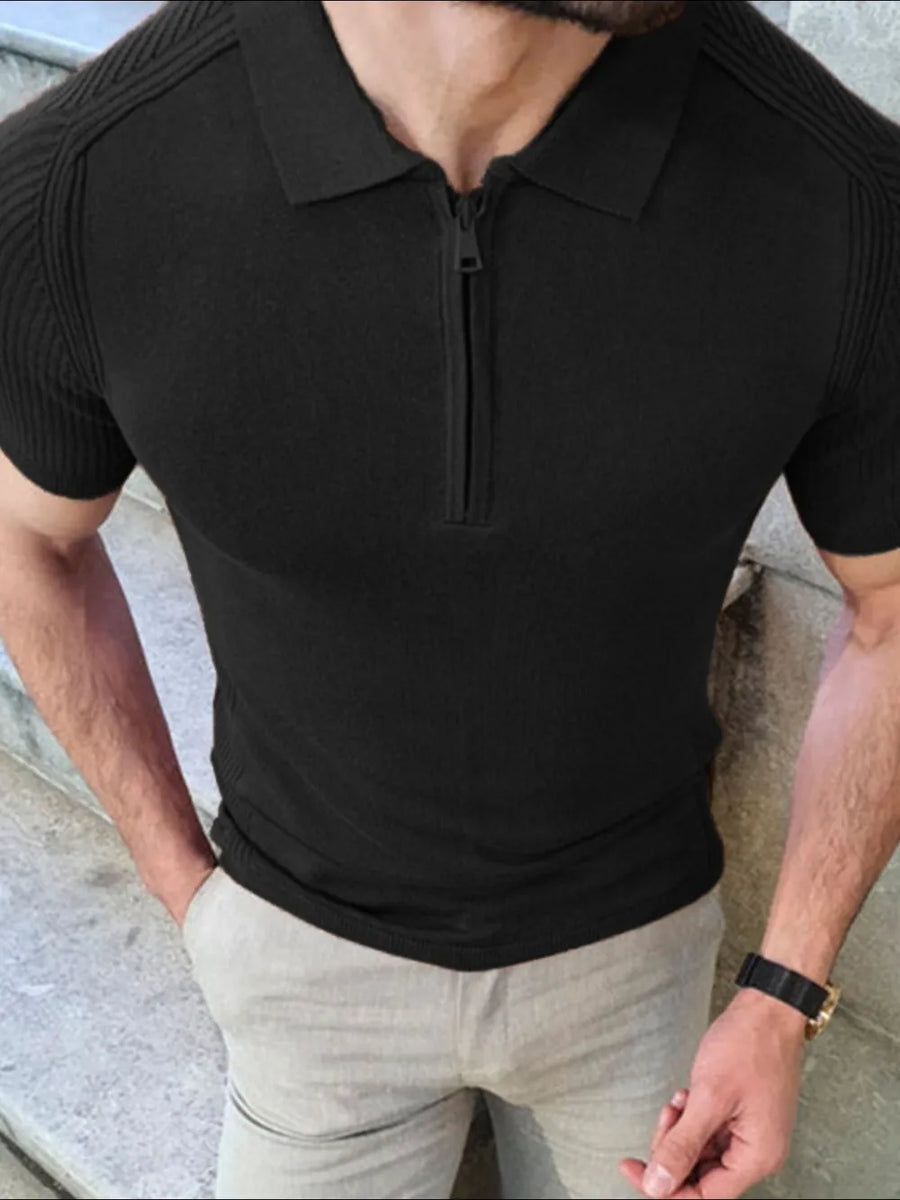 Black textured knit polo shirt with zip neck and short sleeves