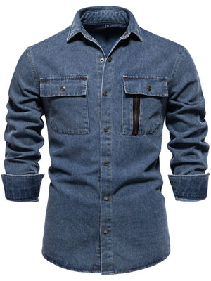 Light blue denim utility shirt with two chest pockets, one with a zip closure.
