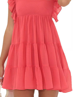 Tiered mini dress in watermelon red with ruffled square neck and flutter sleeves.