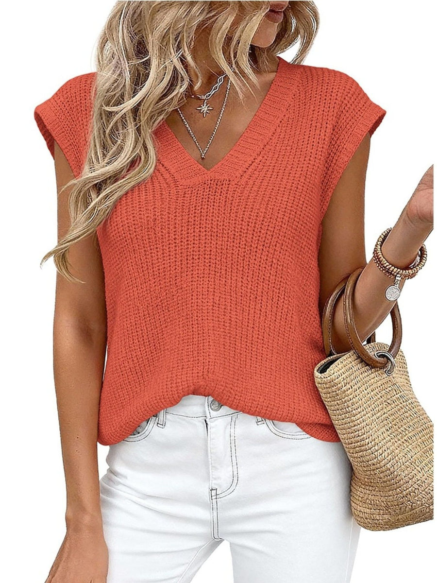 Textured V-neck sweater vest in apricot with cap sleeves.