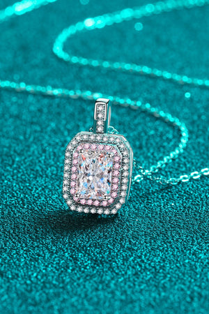 Silver halo necklace with radiant cut moissanite and pink accent stones.