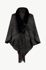 Textured knit cape in Dark Gray with faux fur collar and fringe detail.