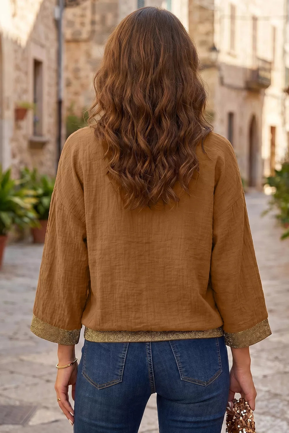 100% polyester Care instructions: Machine wash cold button-up shirt in Caramel with relaxed silhouette