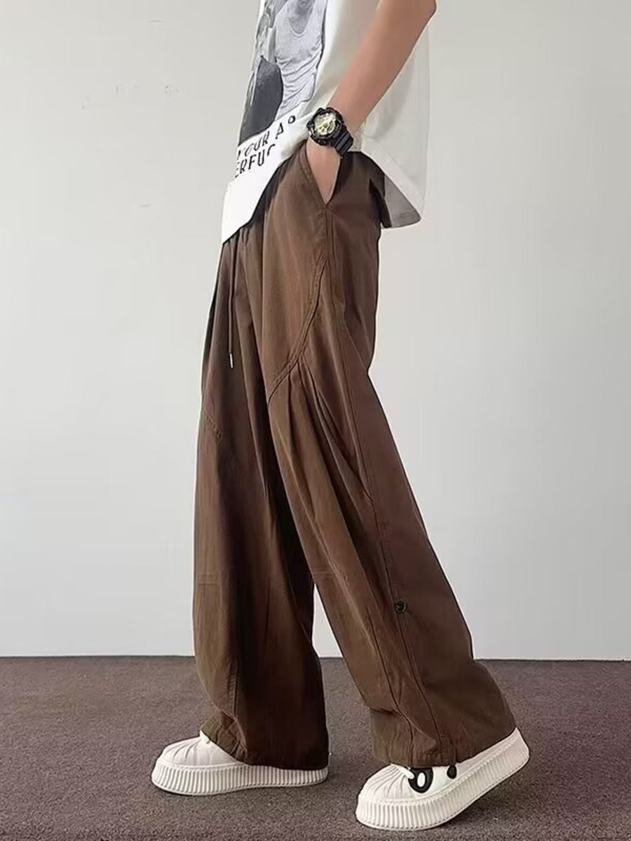 Brown wide leg pants with drawstring waist and button detail