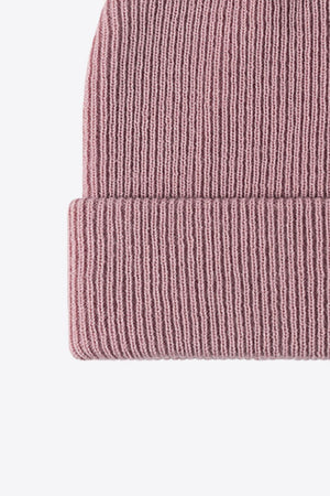Pink ribbed knit beanie with a cuffed brim