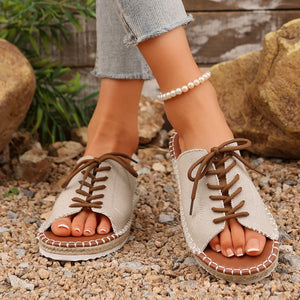 Luxe lace-up open-toe flats in off-white canvas with brown laces and espadrille sole.