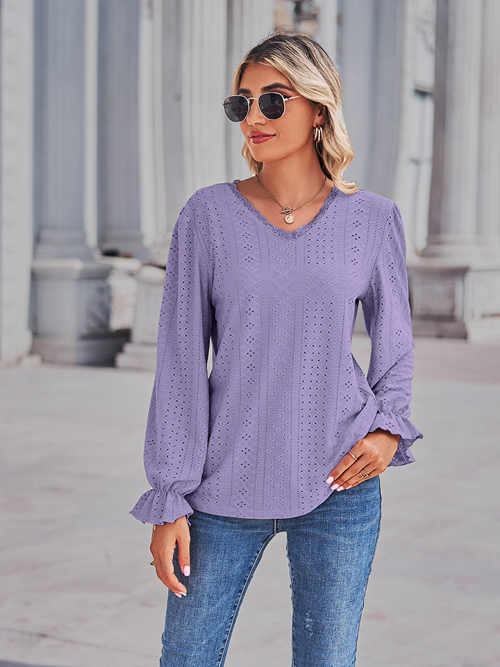 Lavender lace-cut prairie blouse with v-neck, ruffled long sleeves and eyelet detail.