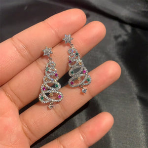 Silver Christmas tree dangle earrings with colorful gemstones and star top.