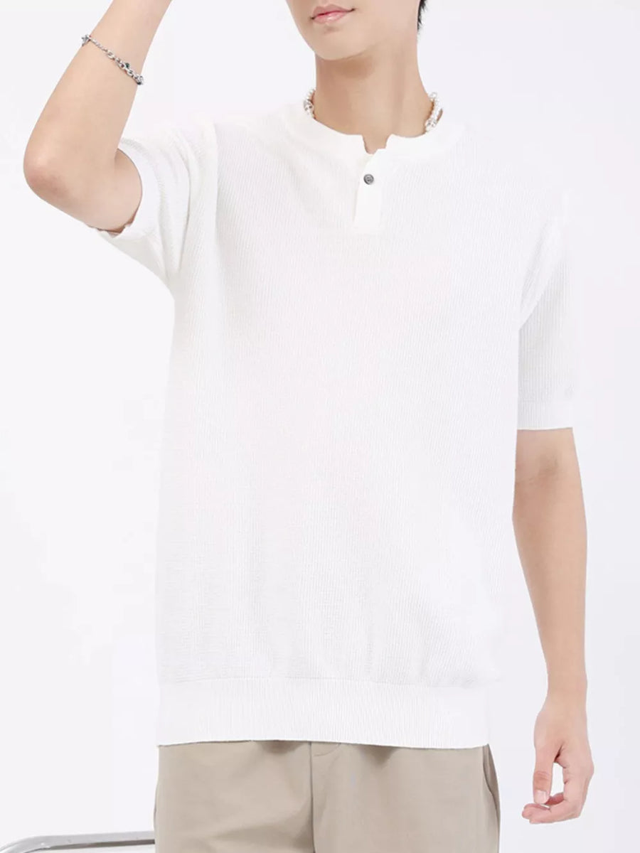 Men's white knit henley t-shirt with short sleeves and button detail.