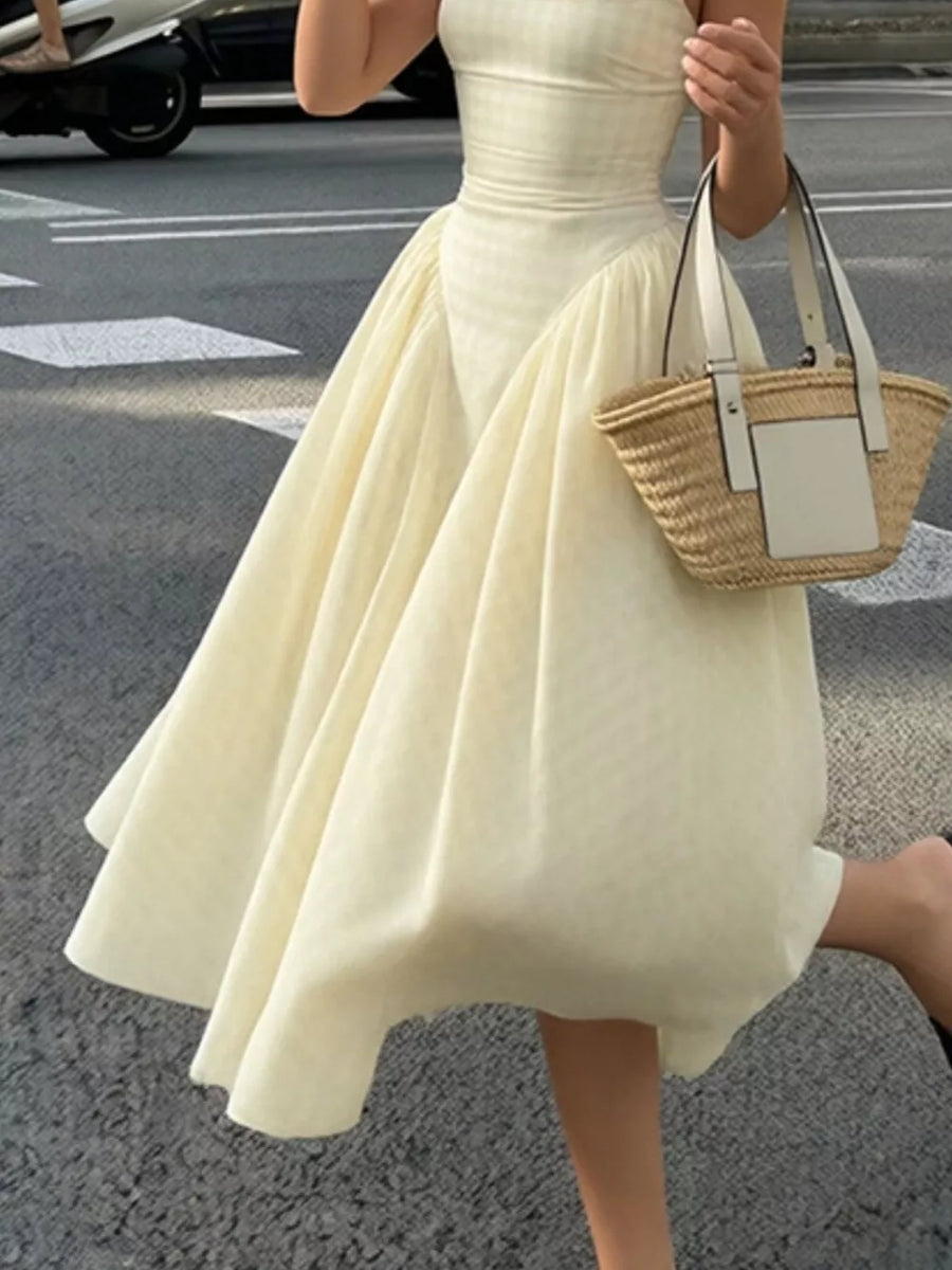 Plaid square neck midi dress in pastel yellow with a-line skirt and voluminous hem.