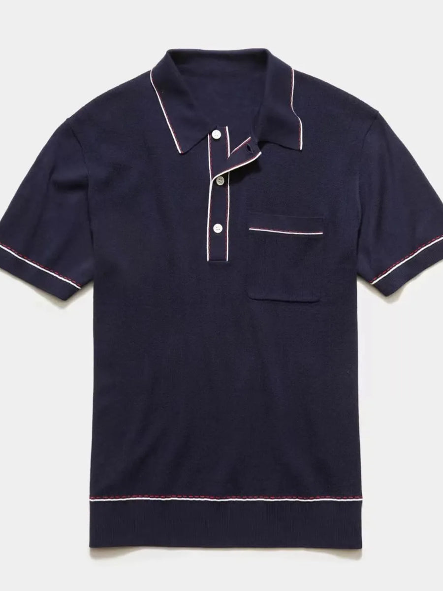 Navy ribbed knit polo shirt with contrast piping and chest pocket.