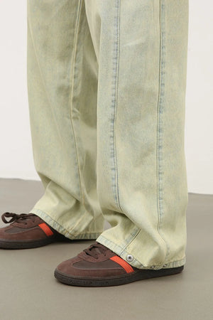 Acid wash wide leg denim trousers in sage with visible stitching detail.