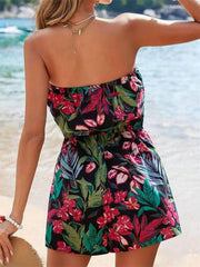 Print strapless ruched romper in multicolor floral pattern with elastic waist.