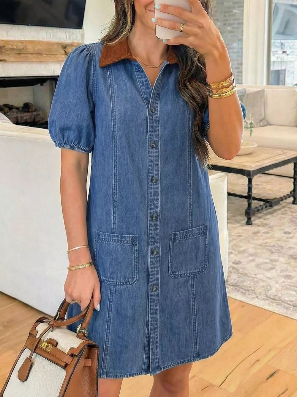 Button-down denim dress with puffed sleeves and a corduroy collar.