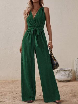 Dark green V-neck tie-waist wide-leg romper with textured fabric and sleeveless design.