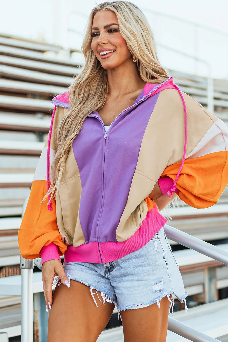Colorblock zip-up hoodie with balloon sleeves in lavender, tan, orange, and pink.