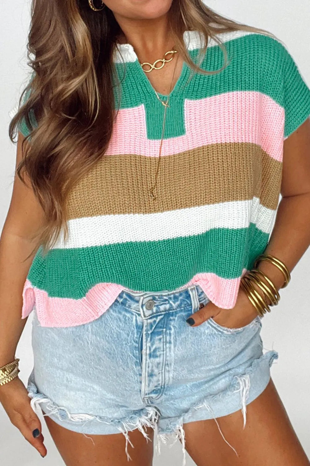 Colorblock knit v-neck tee with short sleeves in multicolor stripes.