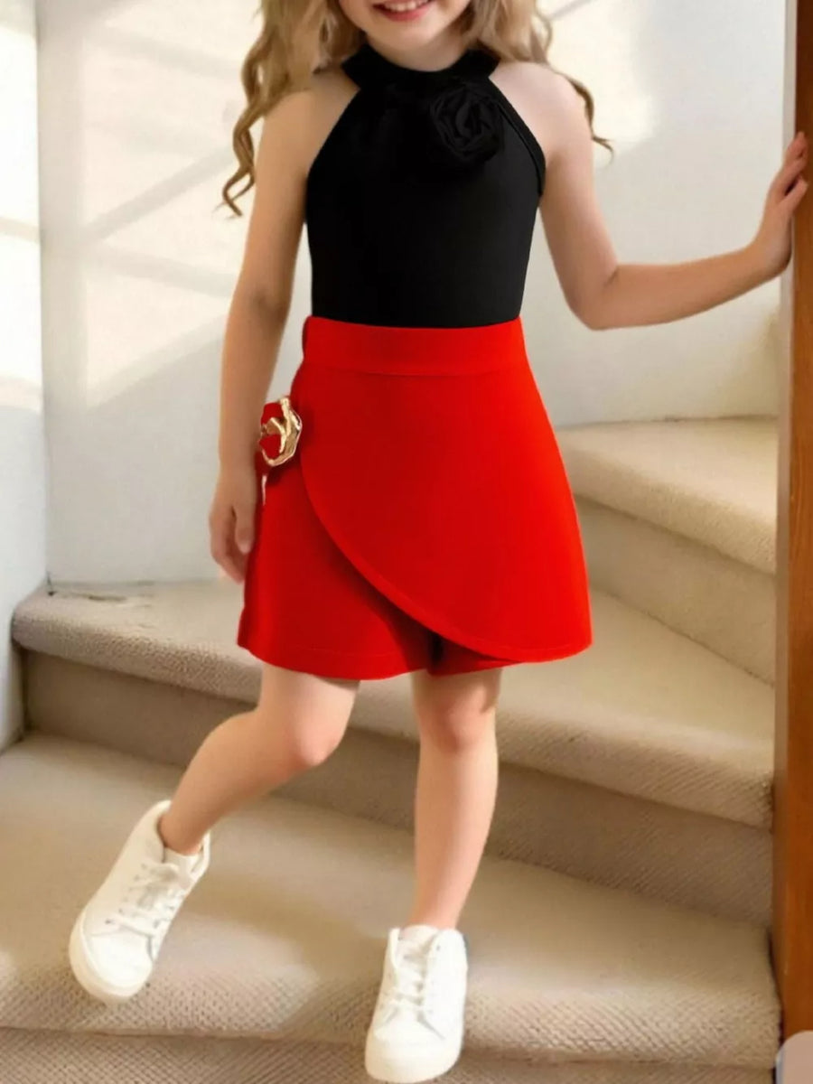 Toddler black halter top with rose detail and red skort with gold buckle detail.