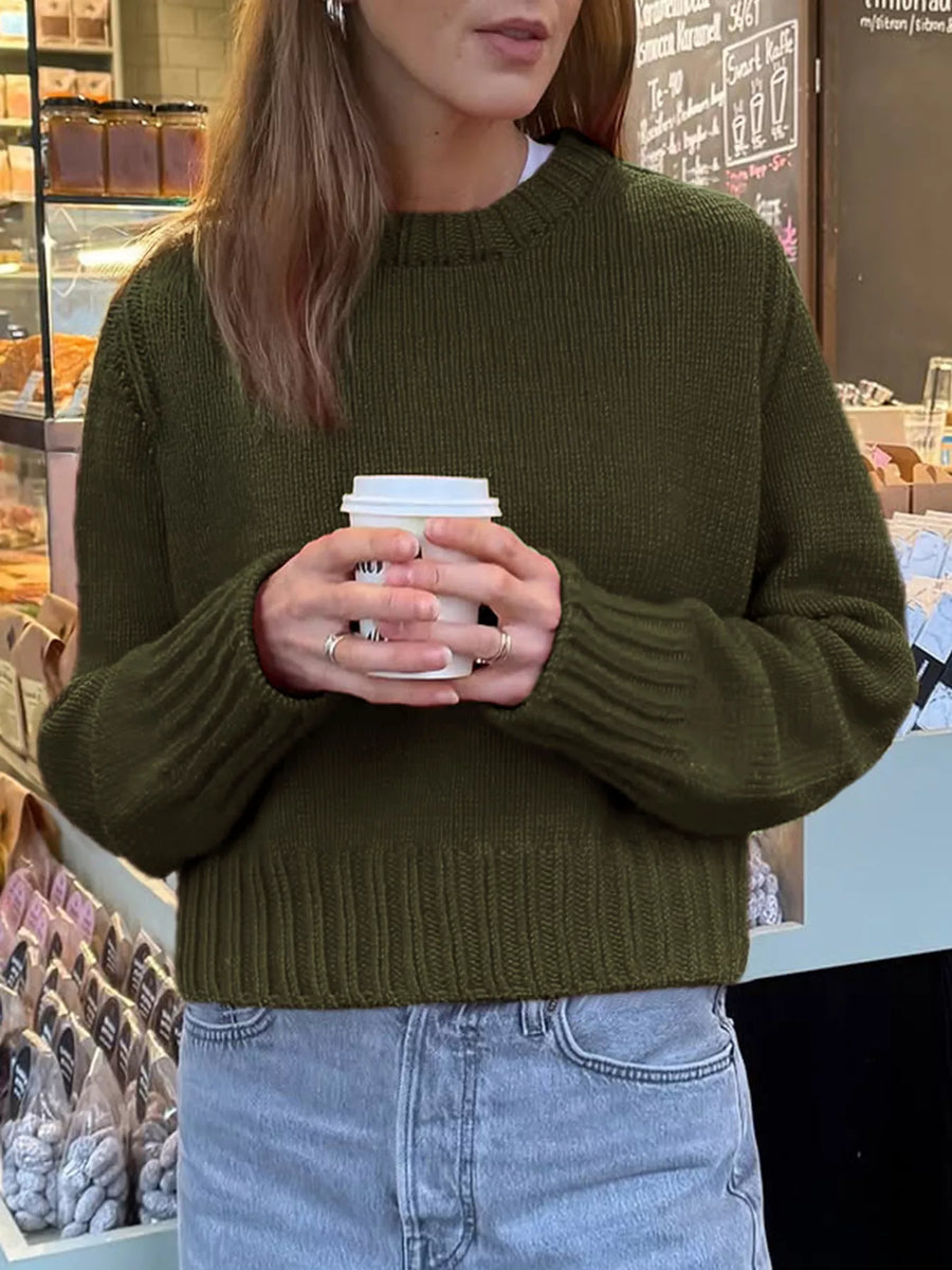 Army green ribbed round-neck knit sweater with long sleeves and a comfortable fit.