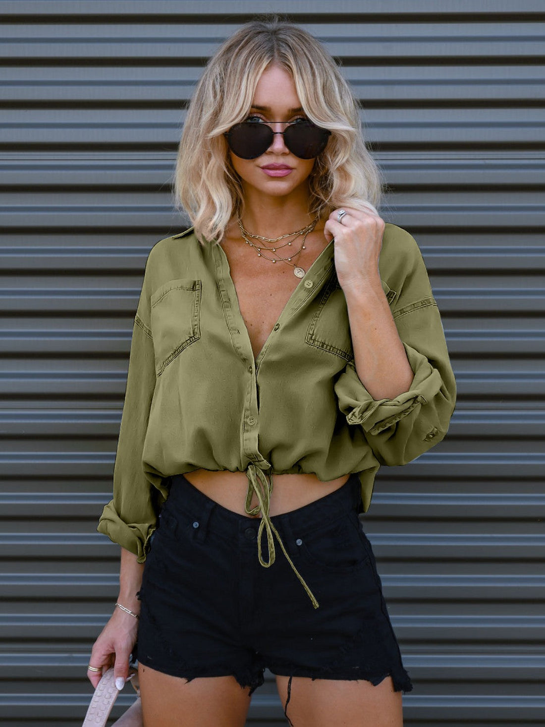 Cropped utility shirt in matcha green cotton with drawstring waist and button-down front.