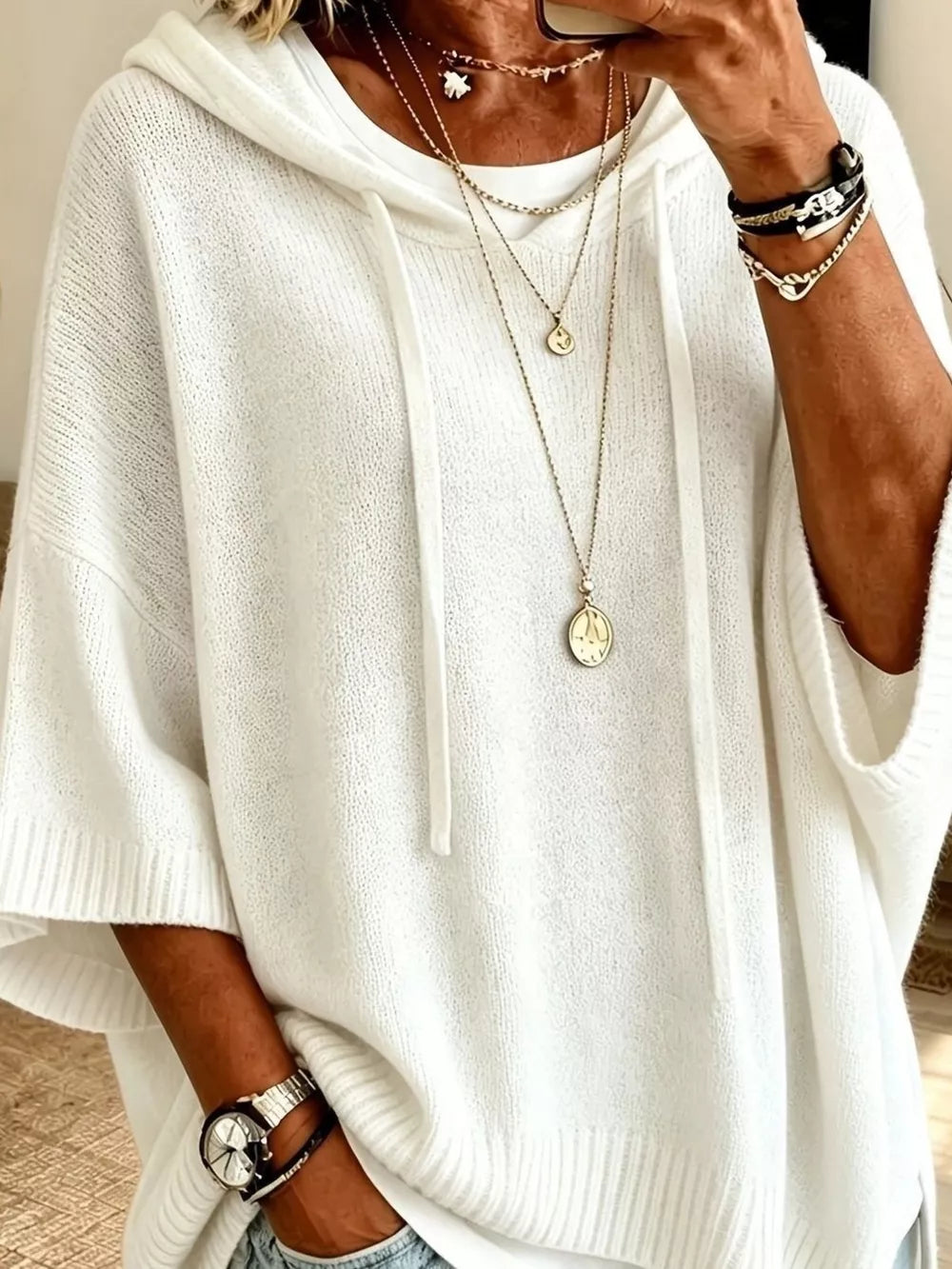 100% polyester Care instructions: Machine wash cold pullover sweater in White with oversized silhouette