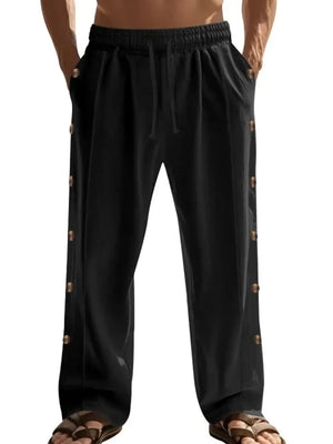 Black linen palazzo trousers with side buttons and drawstring waist.
