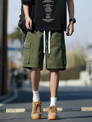 Men's green casual cargo shorts with drawstring and multiple pockets.
