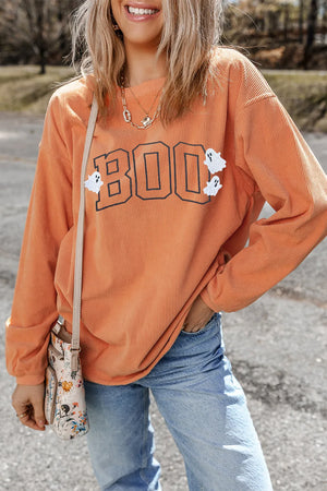 Corduroy sweatshirt in sherbet orange with "Boo" appliqué and ghost details.