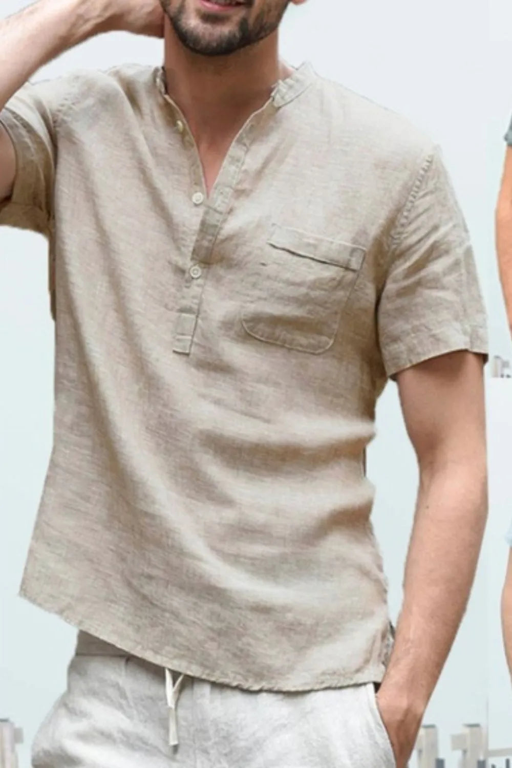 Linen henley shirt in Khaki with short sleeves, band collar, and chest pocket.