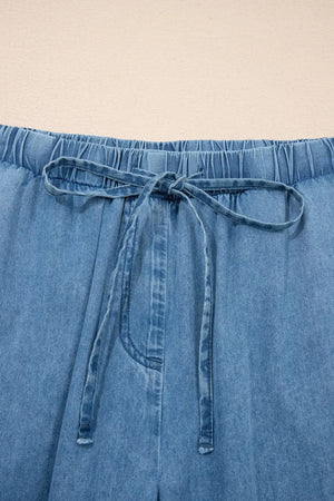 Maternity wide-leg jeans in light wash denim with elastic waistband and drawstring tie.