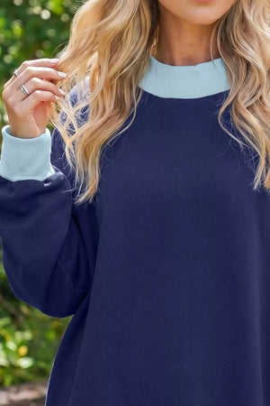 65% polyester, 35% cotton Care instructions: Machine wash cold sweatshirt in navy blue with relaxed silhouette