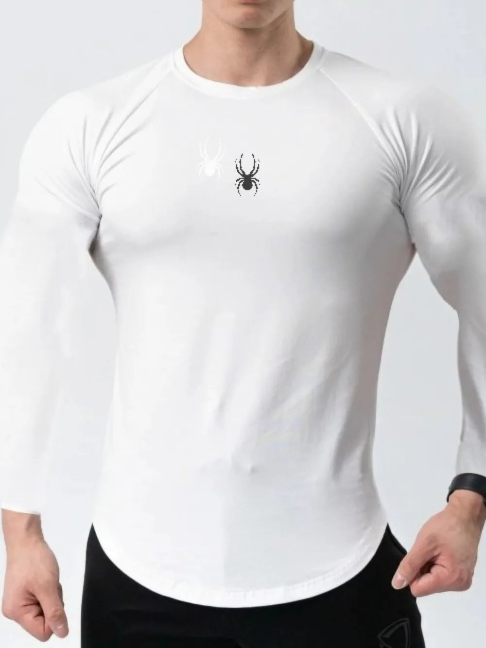 White performance long sleeve top with spider logo detail